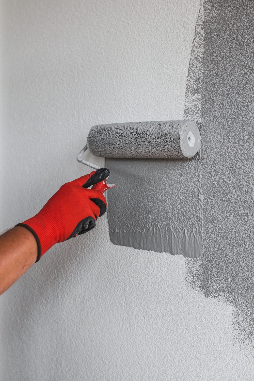handyman painting the wall