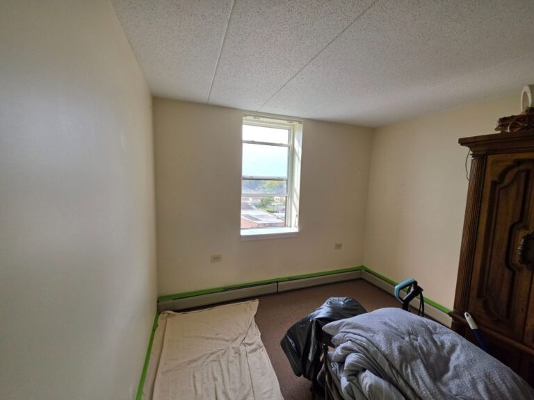 Painted bedroom walls around the window in an Elmwood Park, IL apartment